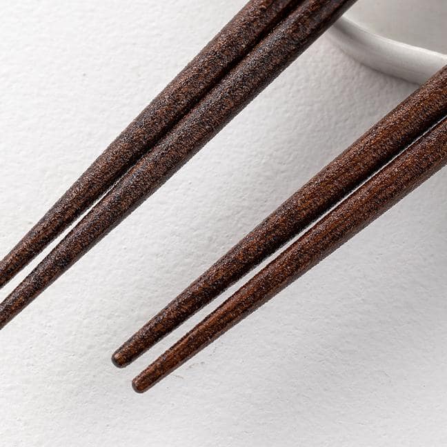 Cat-themed wooden chopsticks with paw prints