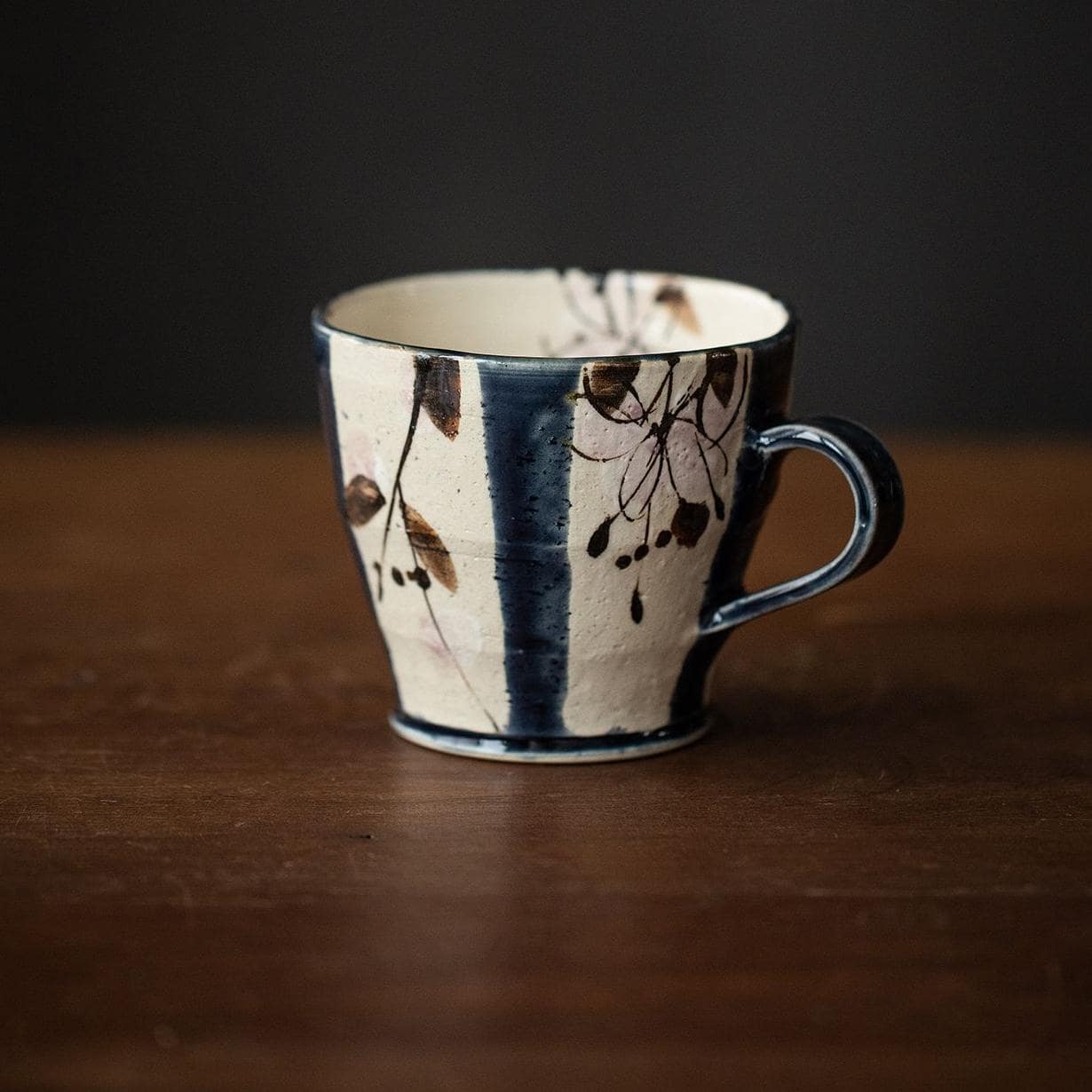 Blue and green striped ceramic mugs for tea and coffee