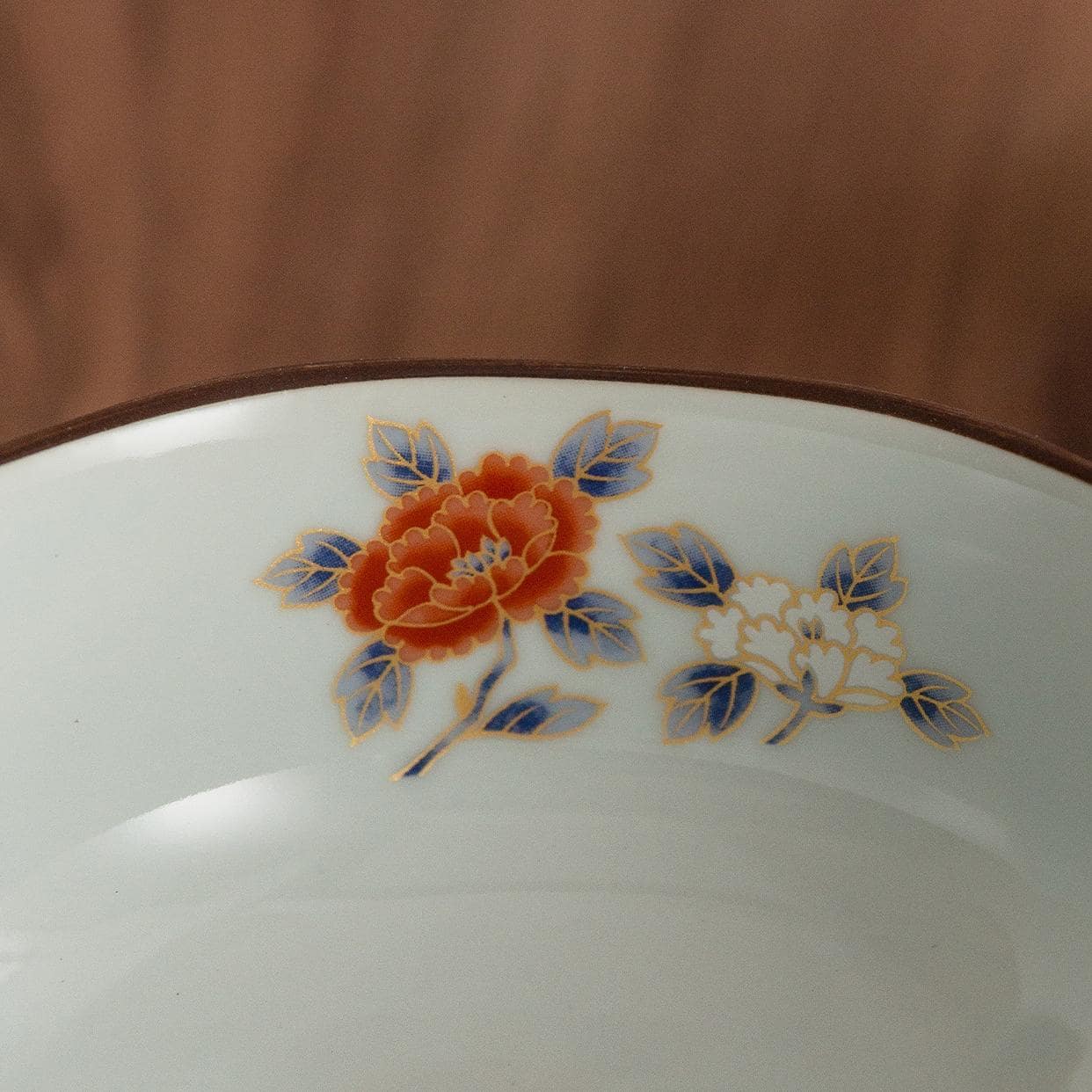 Traditional Japanese soup bowl with floral and geometric patterns.