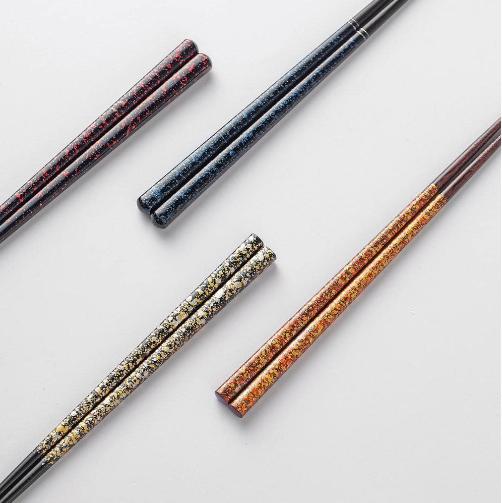 Decorative close-up of chopstick ends showcasing speckled design