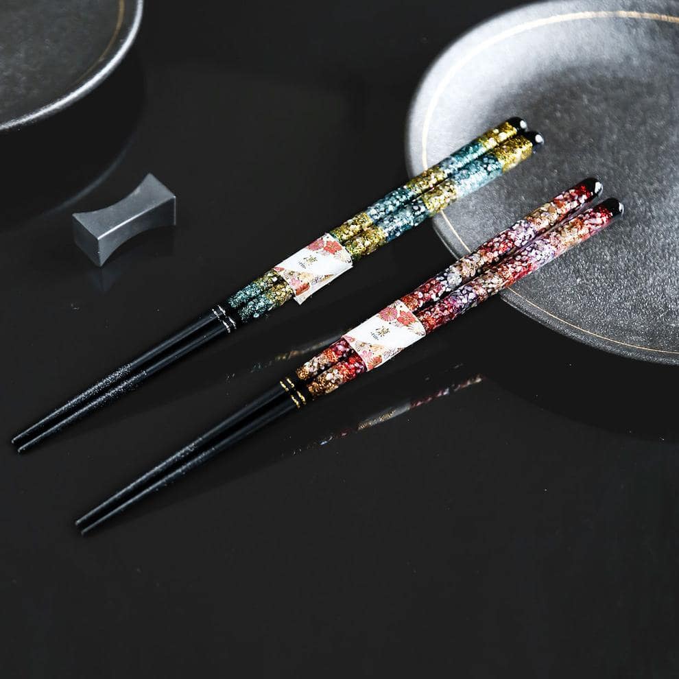 Pair of colorful floral-patterned chopsticks on display.