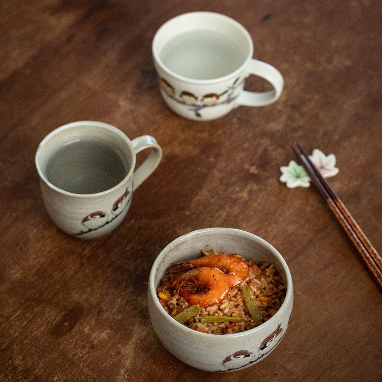 Japanese ceramic cup with delicate sparrow illustrations