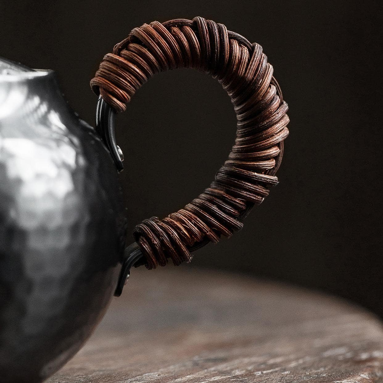 Close-up of the elegant lid design on a copper kettle