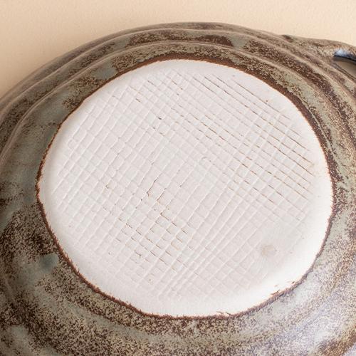 Close-up of crackled glaze texture on ceramic plate