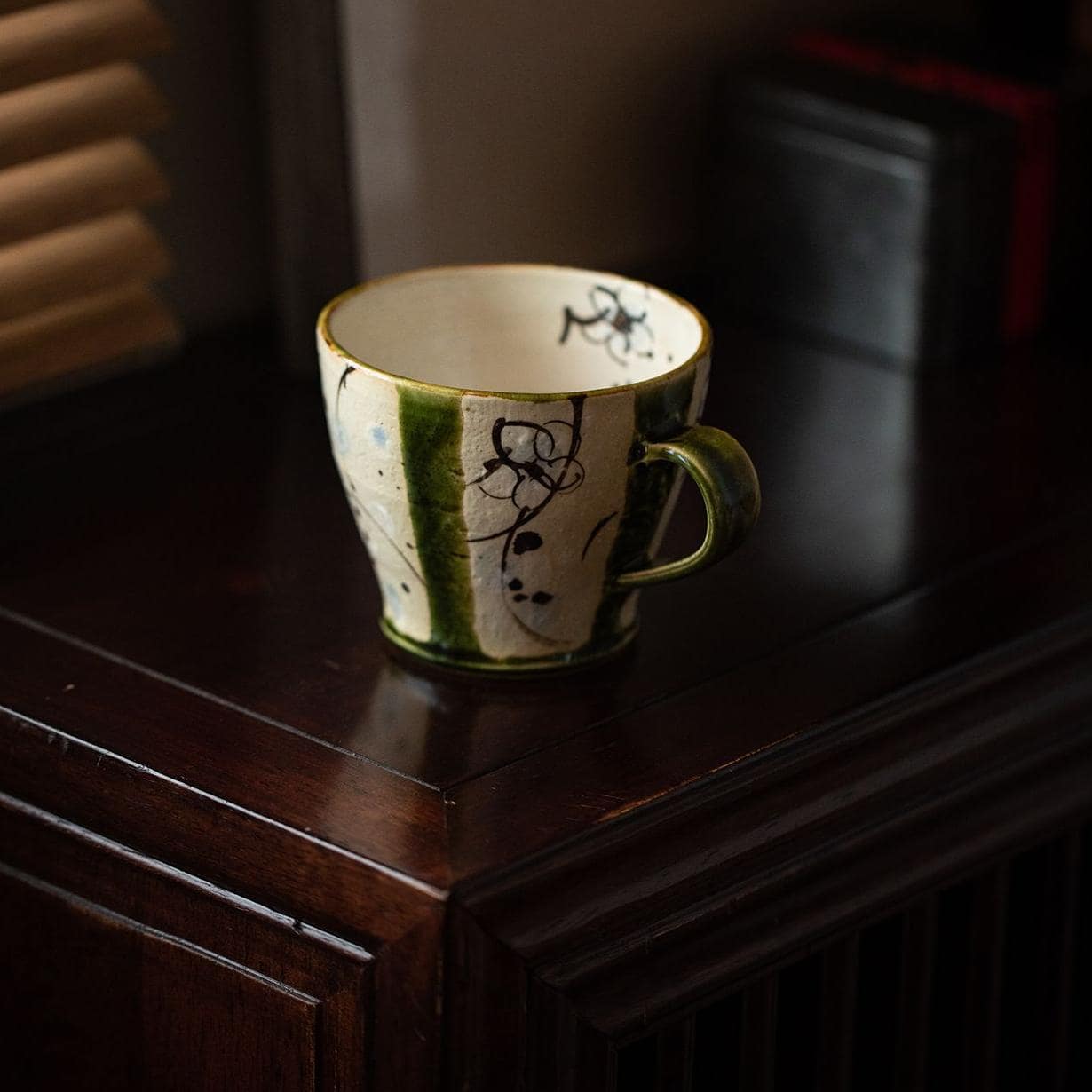 Rustic Japanese ceramic teacups in earthy blue and green tones