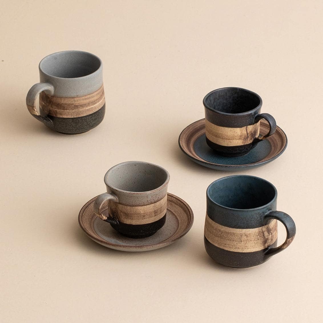 Elegant ceramic cup and saucer set for coffee or tea.