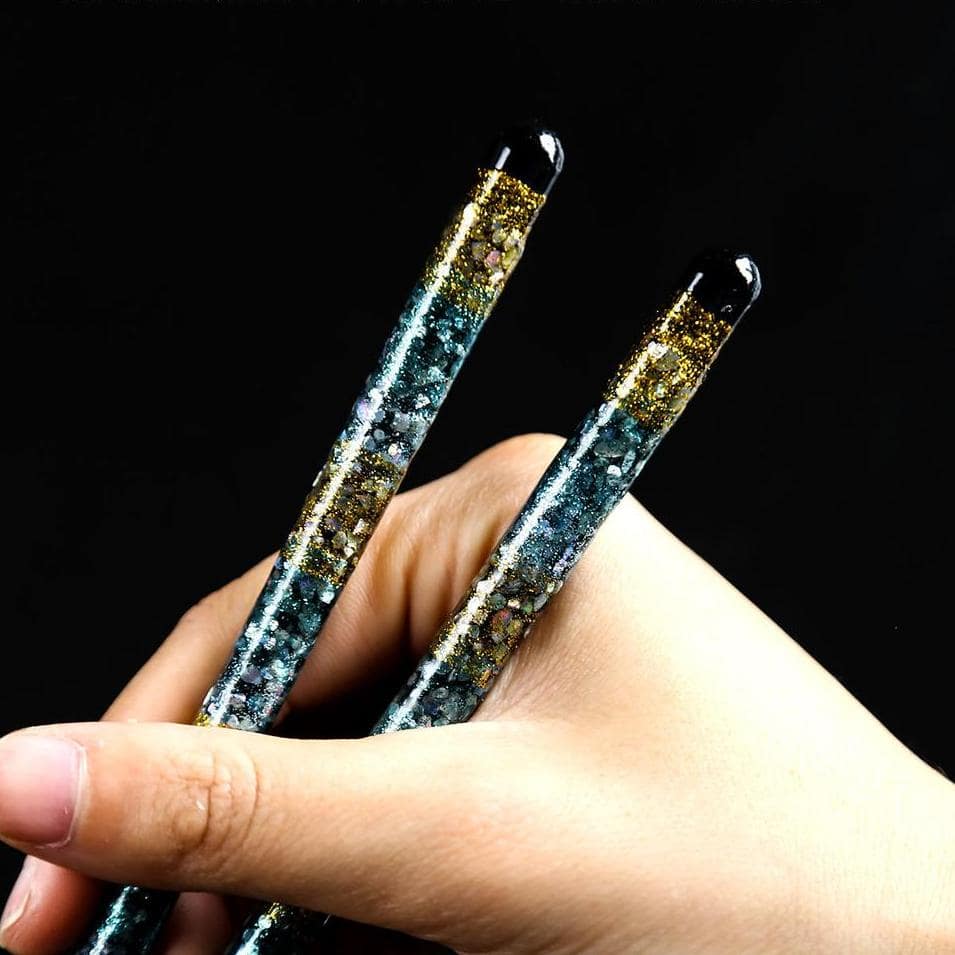 Pair of colorful floral-patterned chopsticks on display.