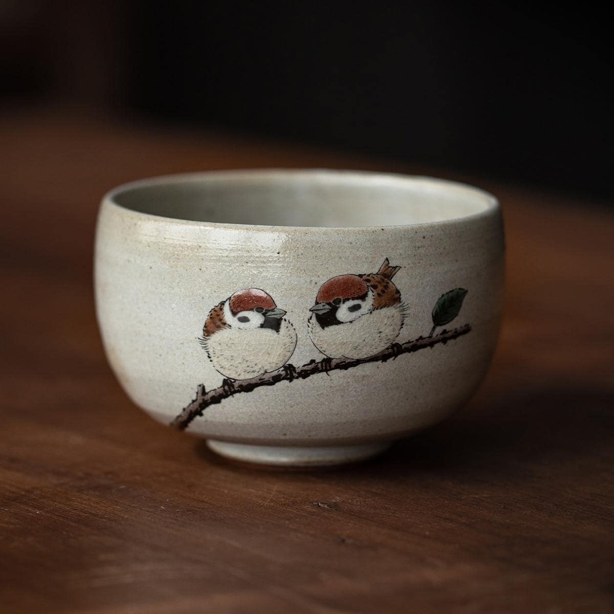 Nature-inspired ceramic tea cup with sparrow design