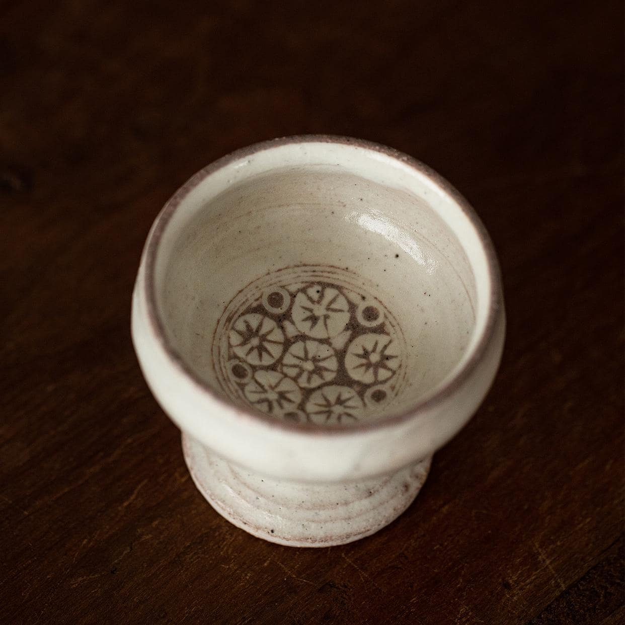 Hand-painted ceramic cup showcasing elegant details