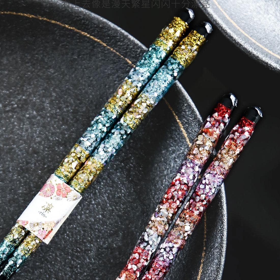 Close-up of premium chopsticks with shimmering floral design.