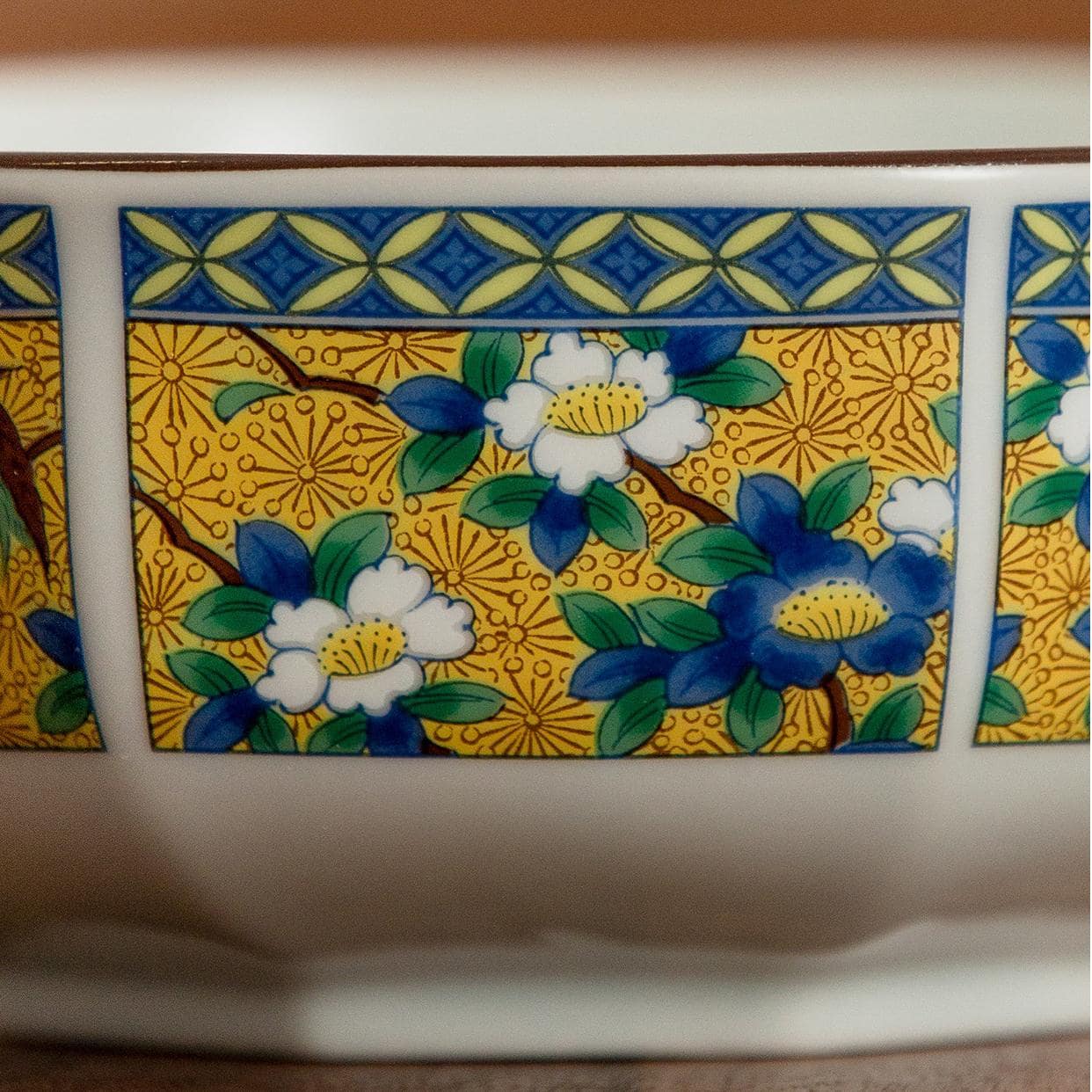 Traditional Japanese soup bowl with floral and geometric patterns.