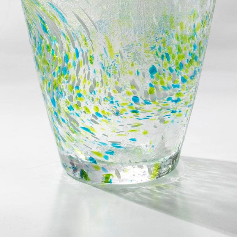 Handcrafted glass tumblers with vibrant swirl patterns