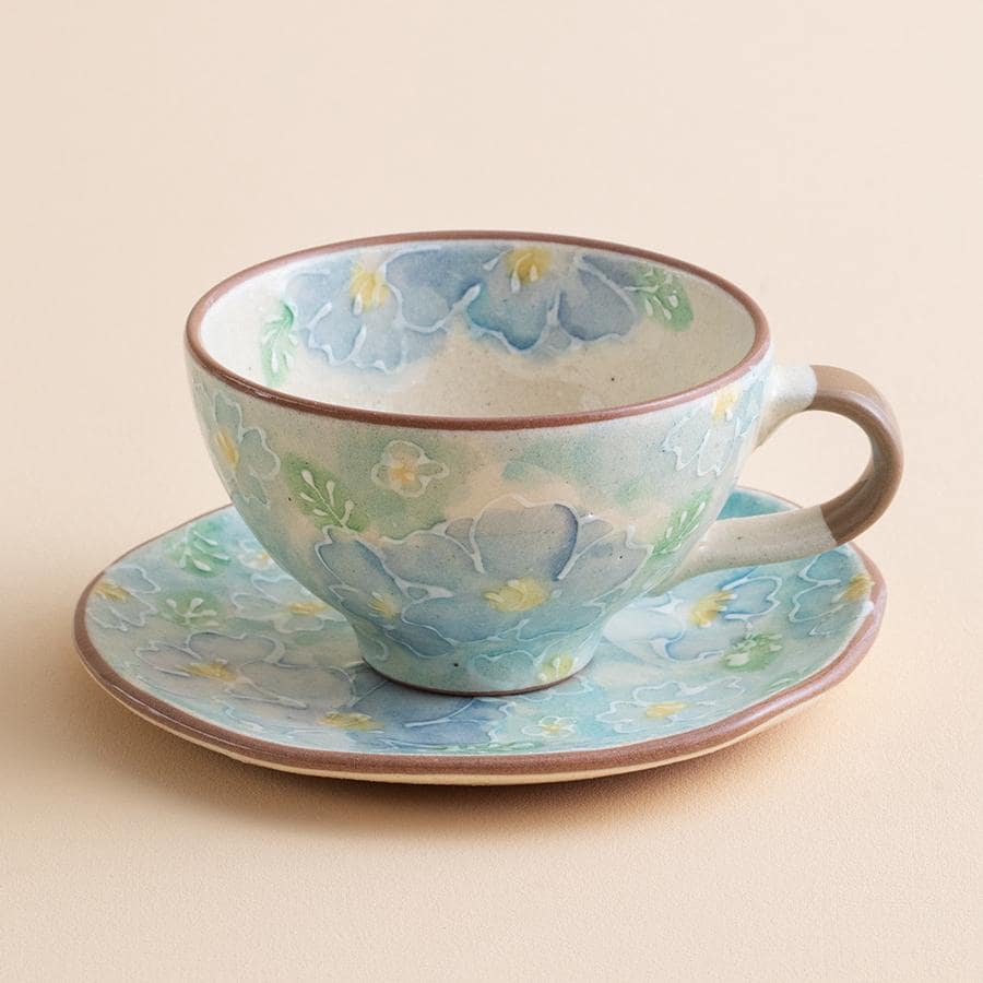 Elegant pastel tea cup with matching saucer close-up