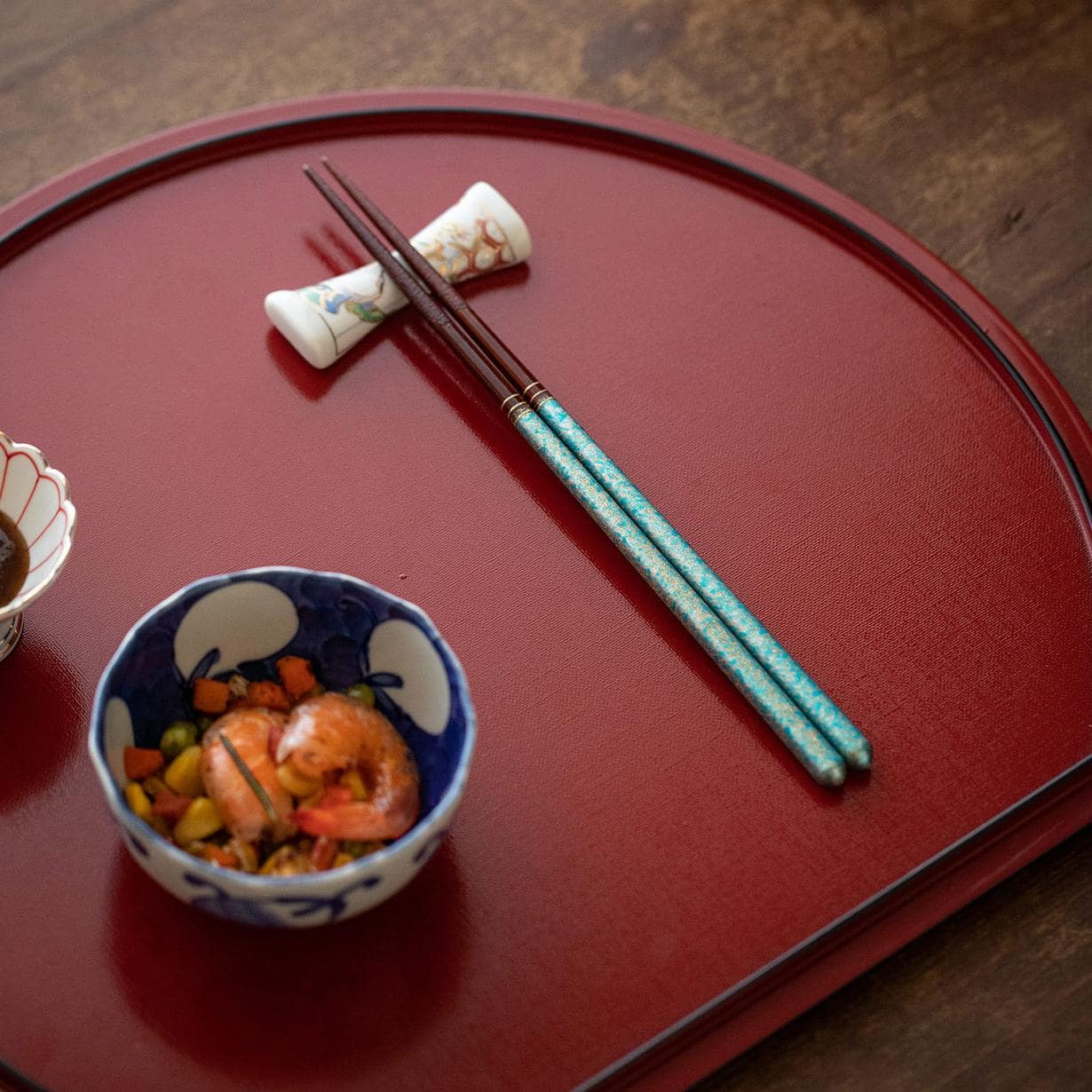 Luxury ISHIDA wooden chopsticks set on a white background.