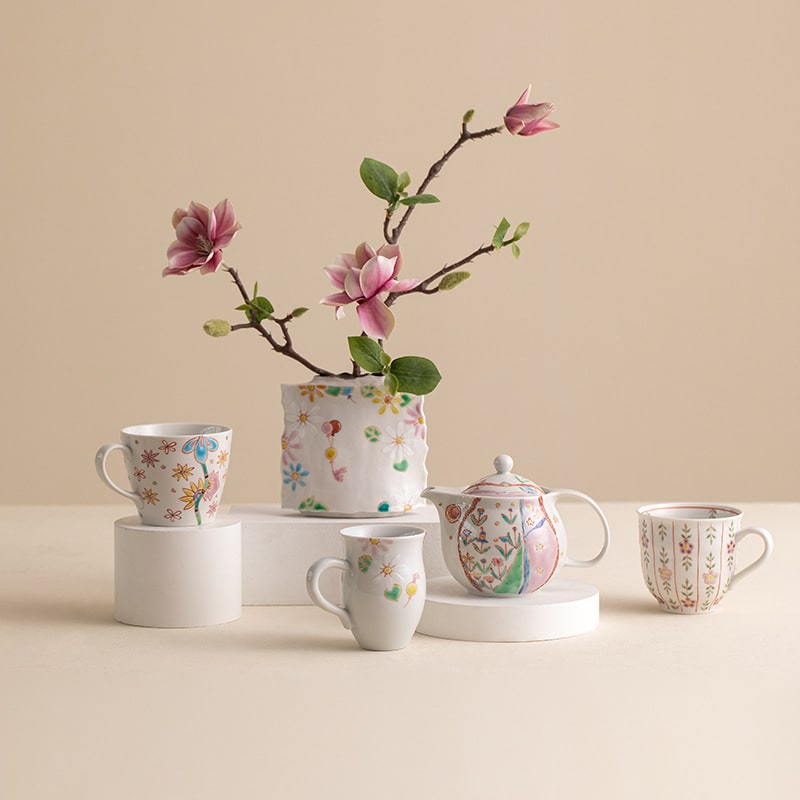 Hand-painted ceramic tea set with floral motifs