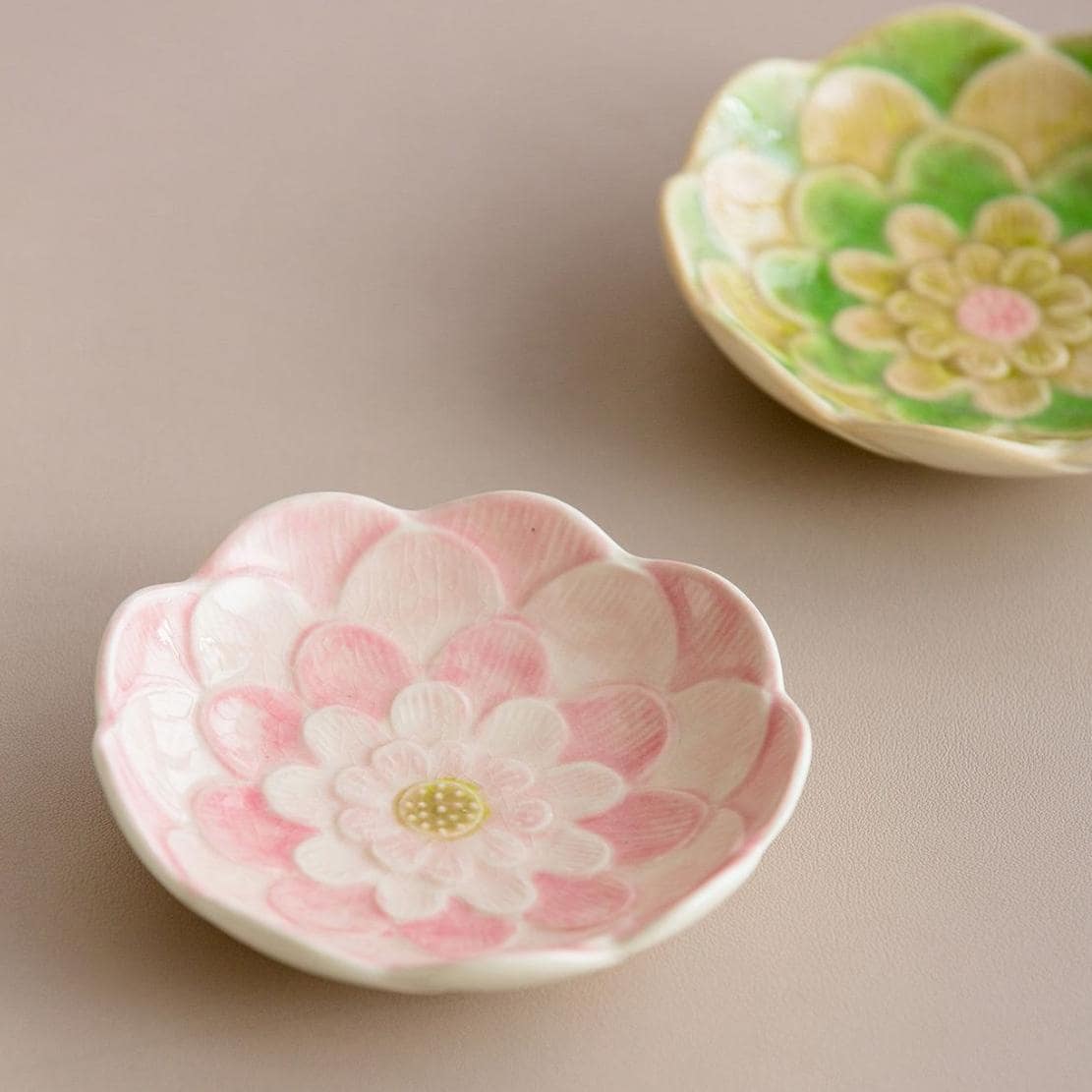 Elegant small Japanese floral dessert and dipping plates on a red tray