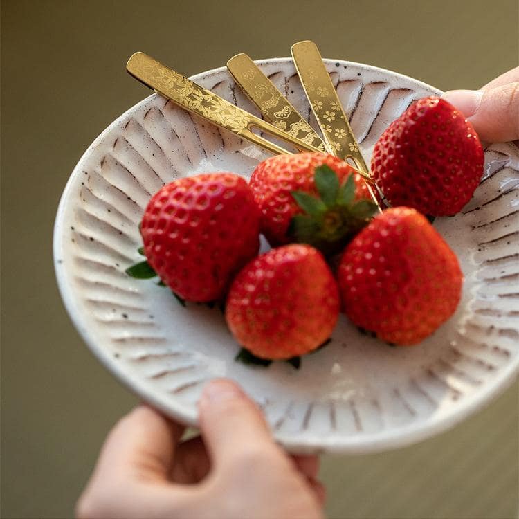 Premium gold dessert fork paired with a modern plate and dessert