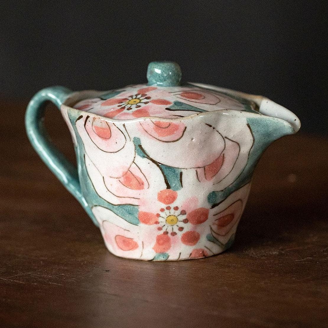 Elegant hand-glazed ceramic teapot with pink and green florals