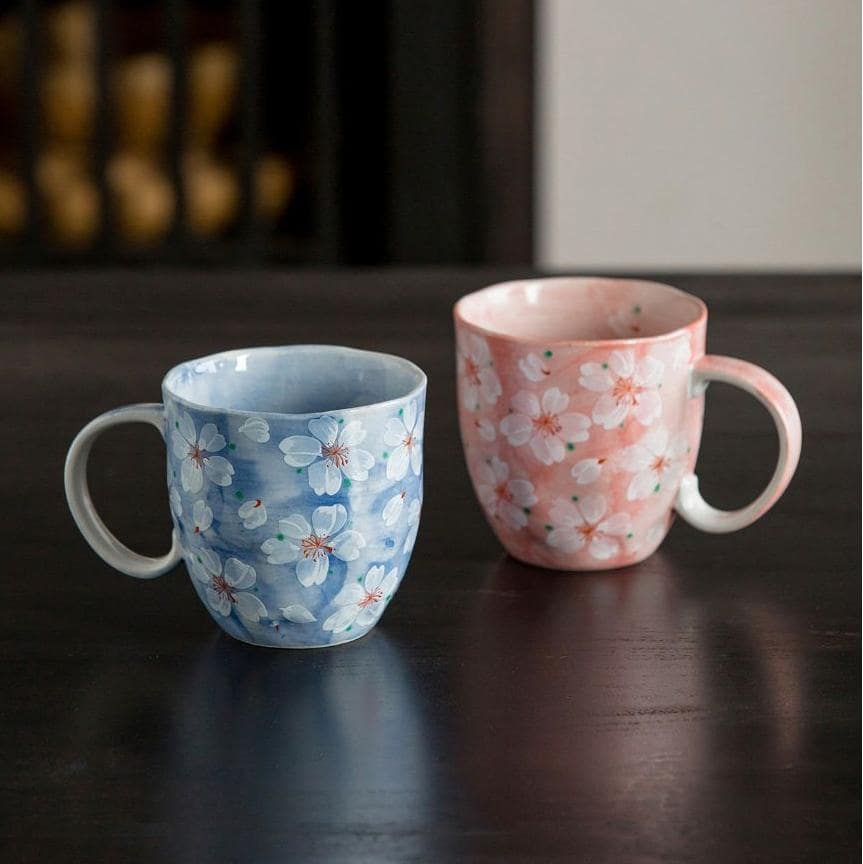 Close-up of the pink cherry blossom ceramic cup interior.