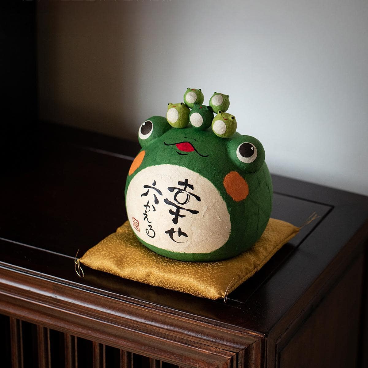 Adorable travel peace frog figurine with hand-painted details.