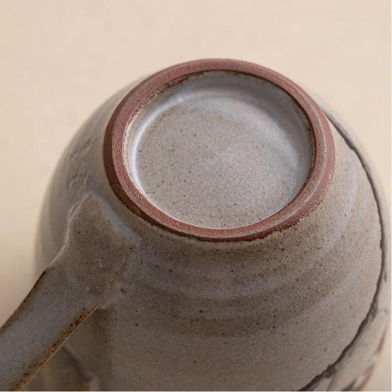 Nature-inspired ceramic tea cup with sparrow design