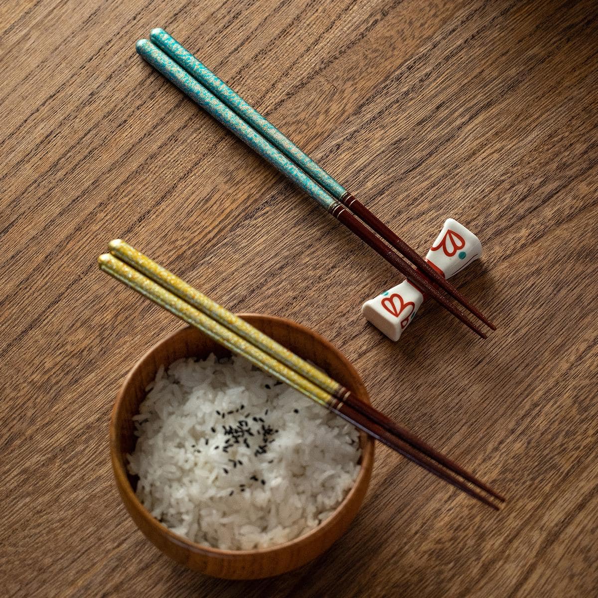 High-value Japanese chopsticks placed on a ceramic dish.