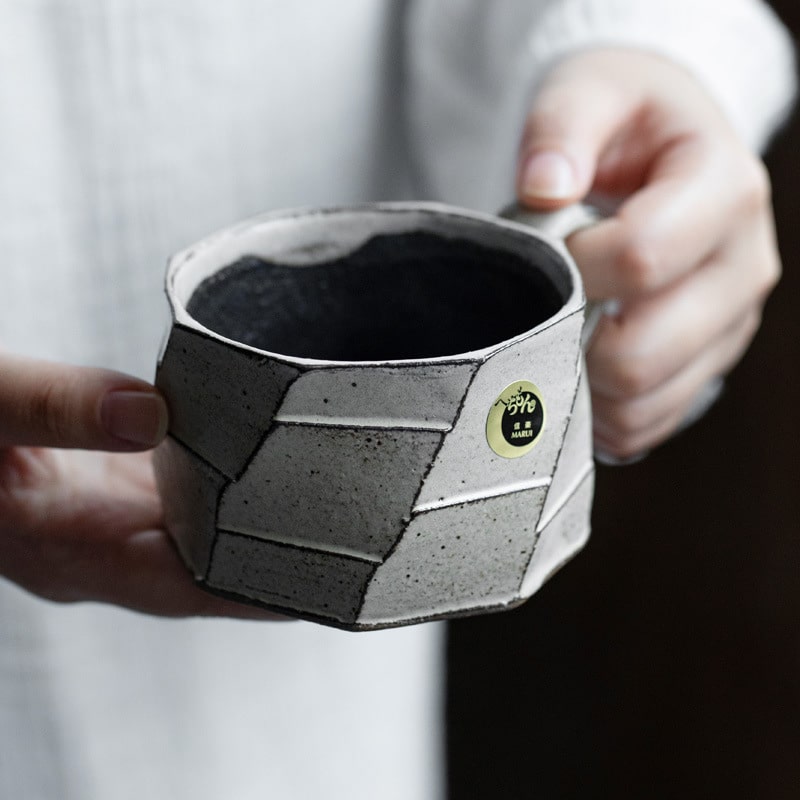 Eco-friendly artisan ceramic mug in stylish packaging