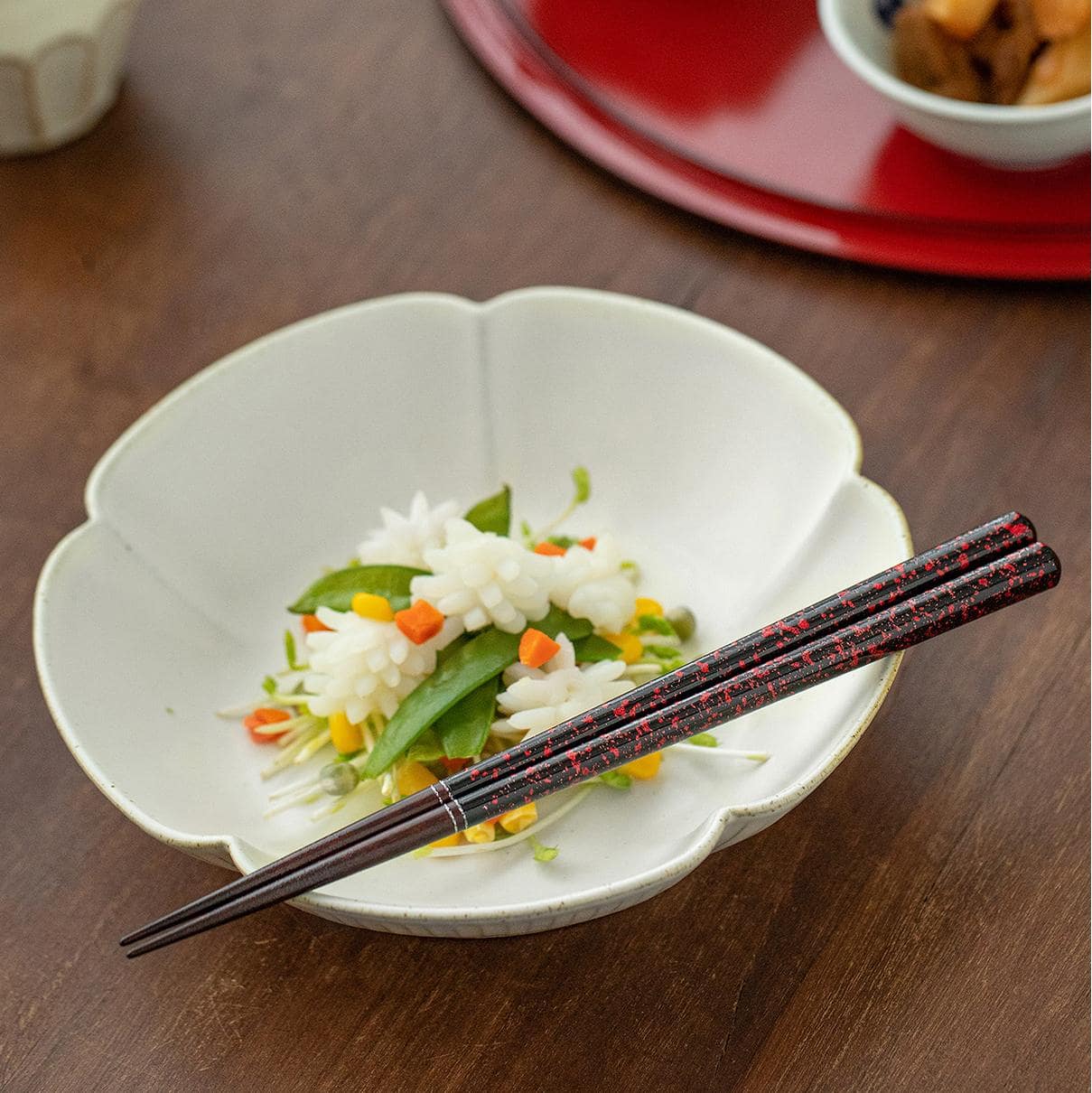 Decorative close-up of chopstick ends showcasing speckled design