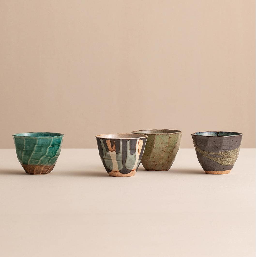 Set of artisan Japanese ceramic cups on display