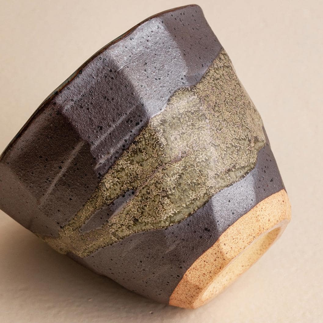 Four handcrafted Japanese ceramic cups in earthy tones