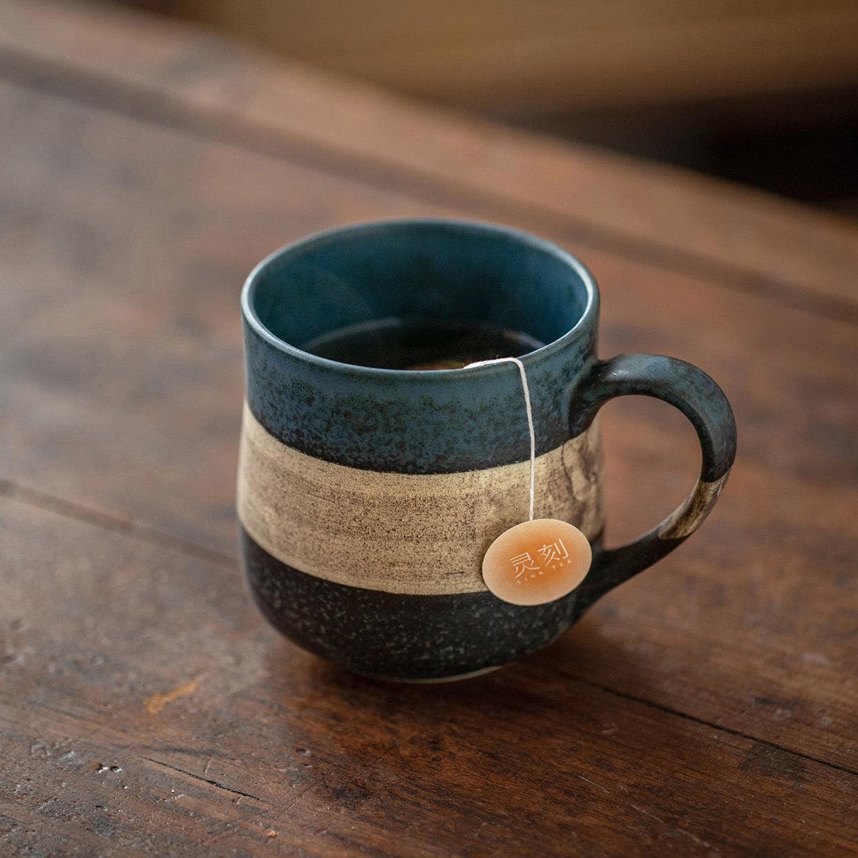 Artisan-crafted ceramic mug with a natural texture.