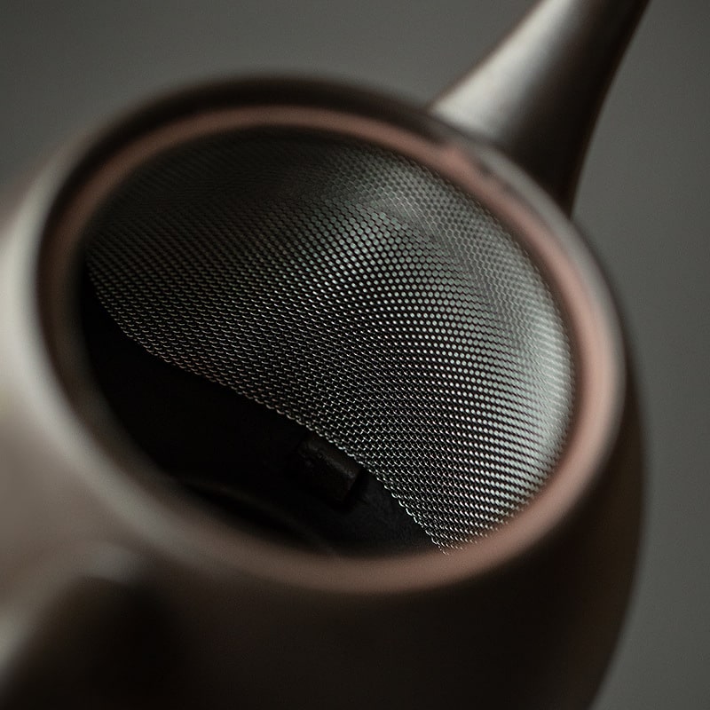 Elegant Japanese teapot on a wooden shelf