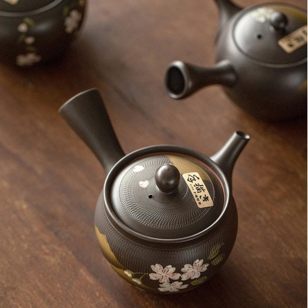 Close-up of cherry blossom design on Japanese teapot