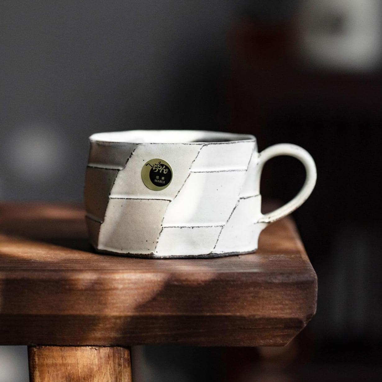 Handcrafted ceramic mug with patchwork design