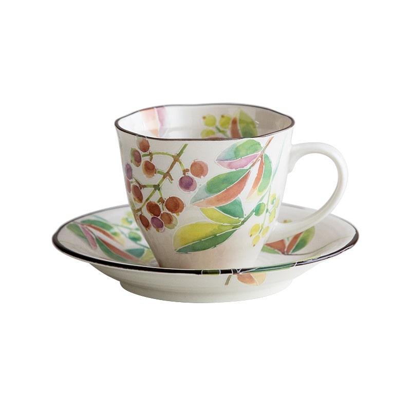 Vibrant cherry blossom and floral design ceramic tea and coffee set.