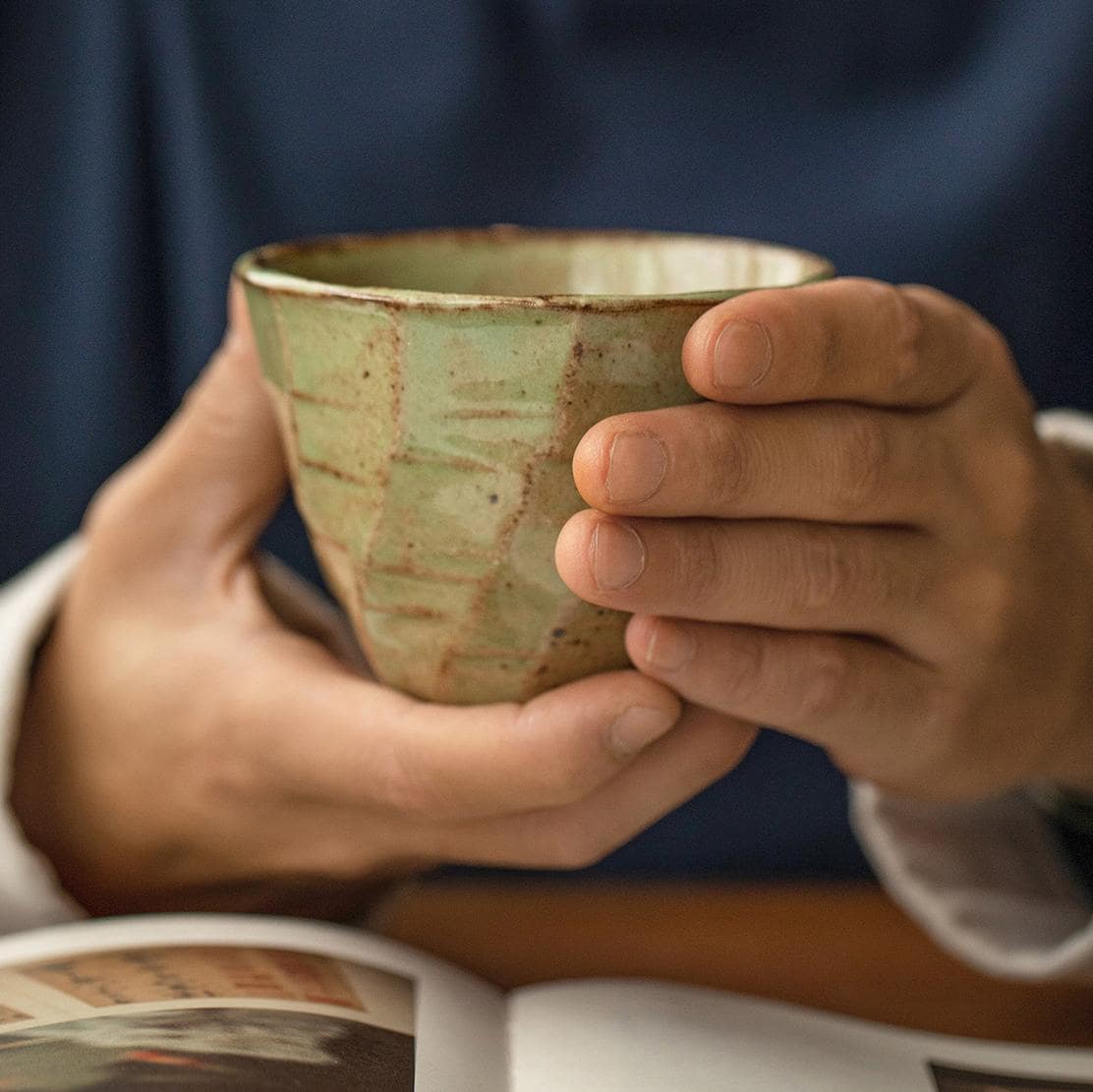 Set of artisan Japanese ceramic cups on display