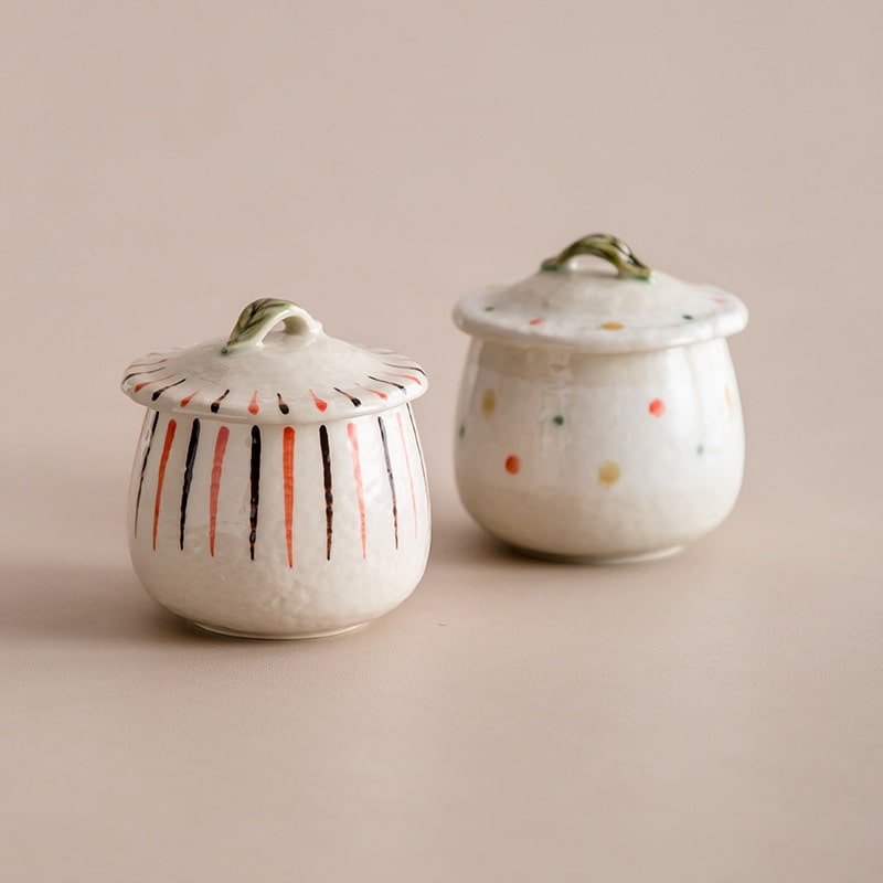 Artisan ceramic stew pots with polka dot patterns