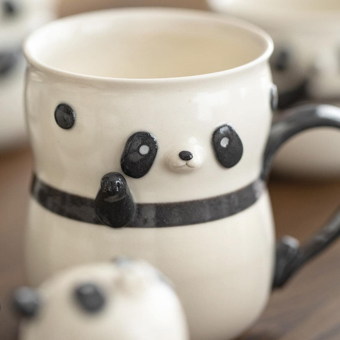 Close-up of 3D panda details on ceramic cup