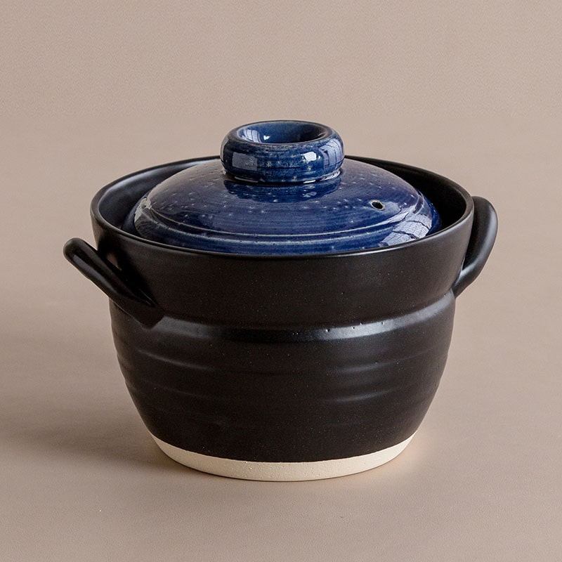 Japanese double-lid clay pot with black and blue glaze design.