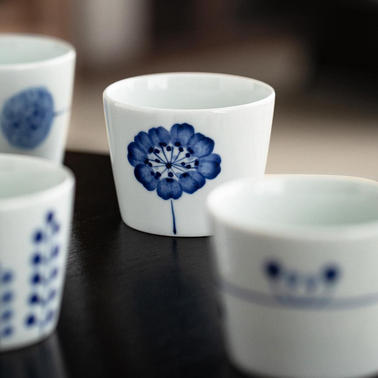 Close-up of the base of a porcelain tea cup with Japanese craftsmanship details.