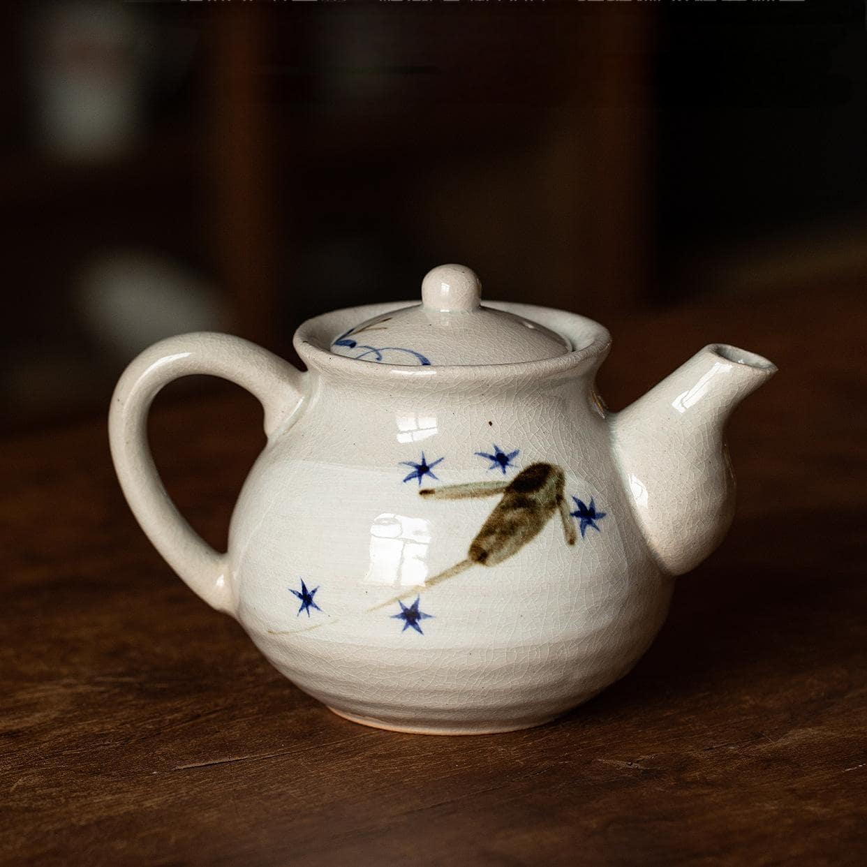 Minimalist handcrafted teapot showcasing elegant cream glaze.