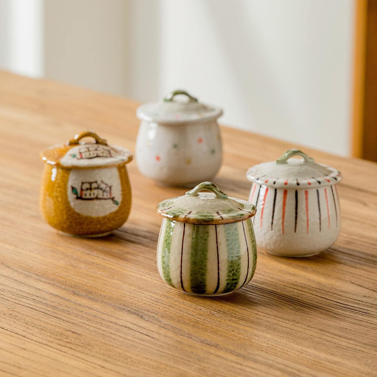 Set of colorful ceramic stew pots for home dining