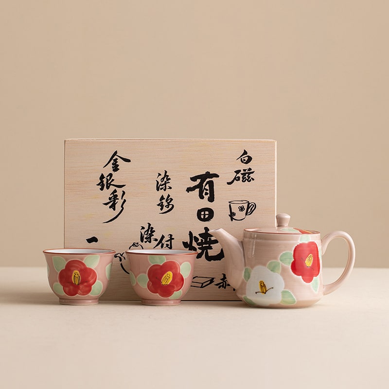 Japanese ceramic tea set with hand-painted camellia flowers.