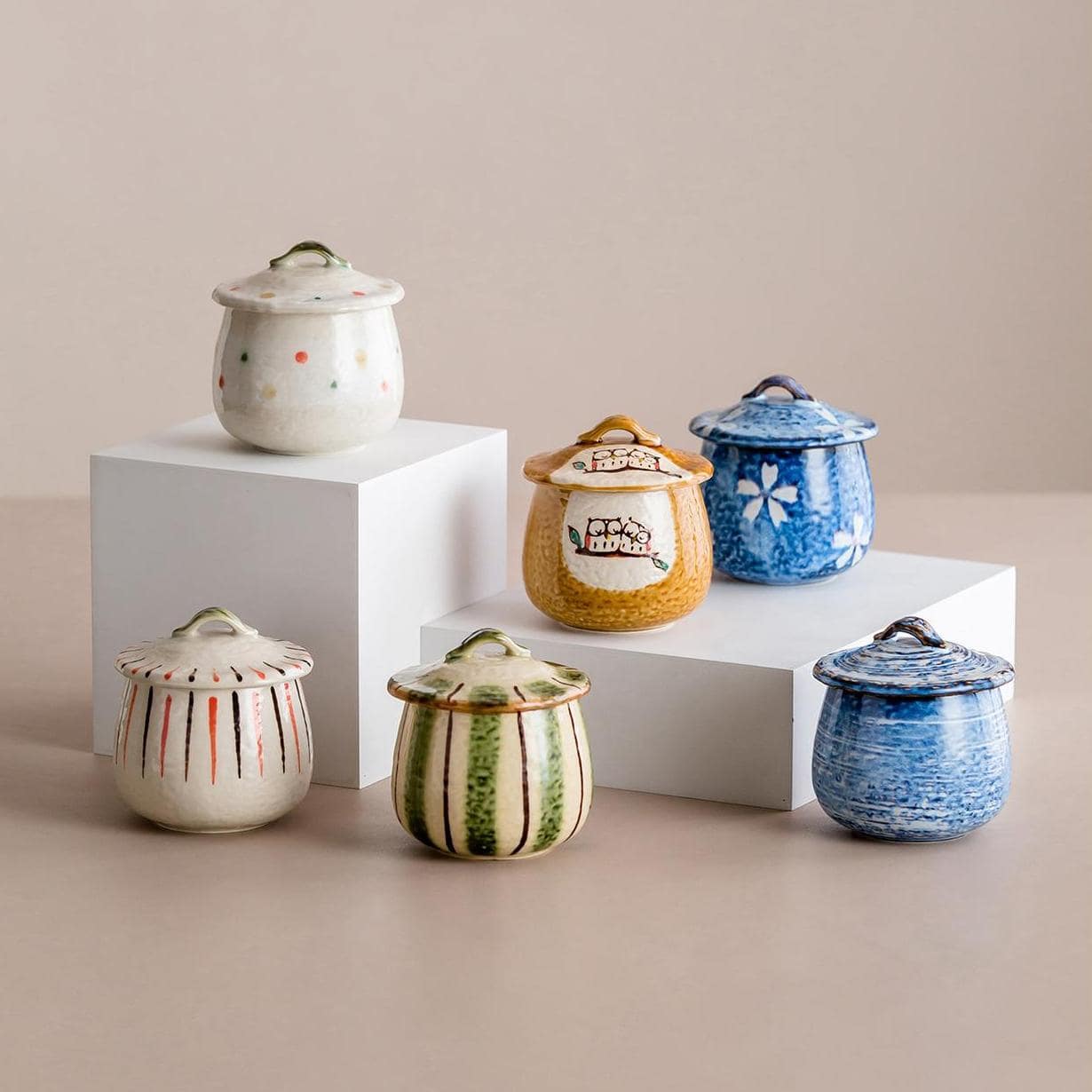 Handcrafted ceramic stew pots with artistic lids