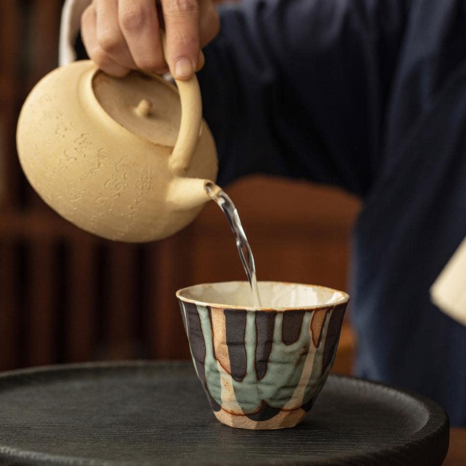 Set of artisan Japanese ceramic cups on display