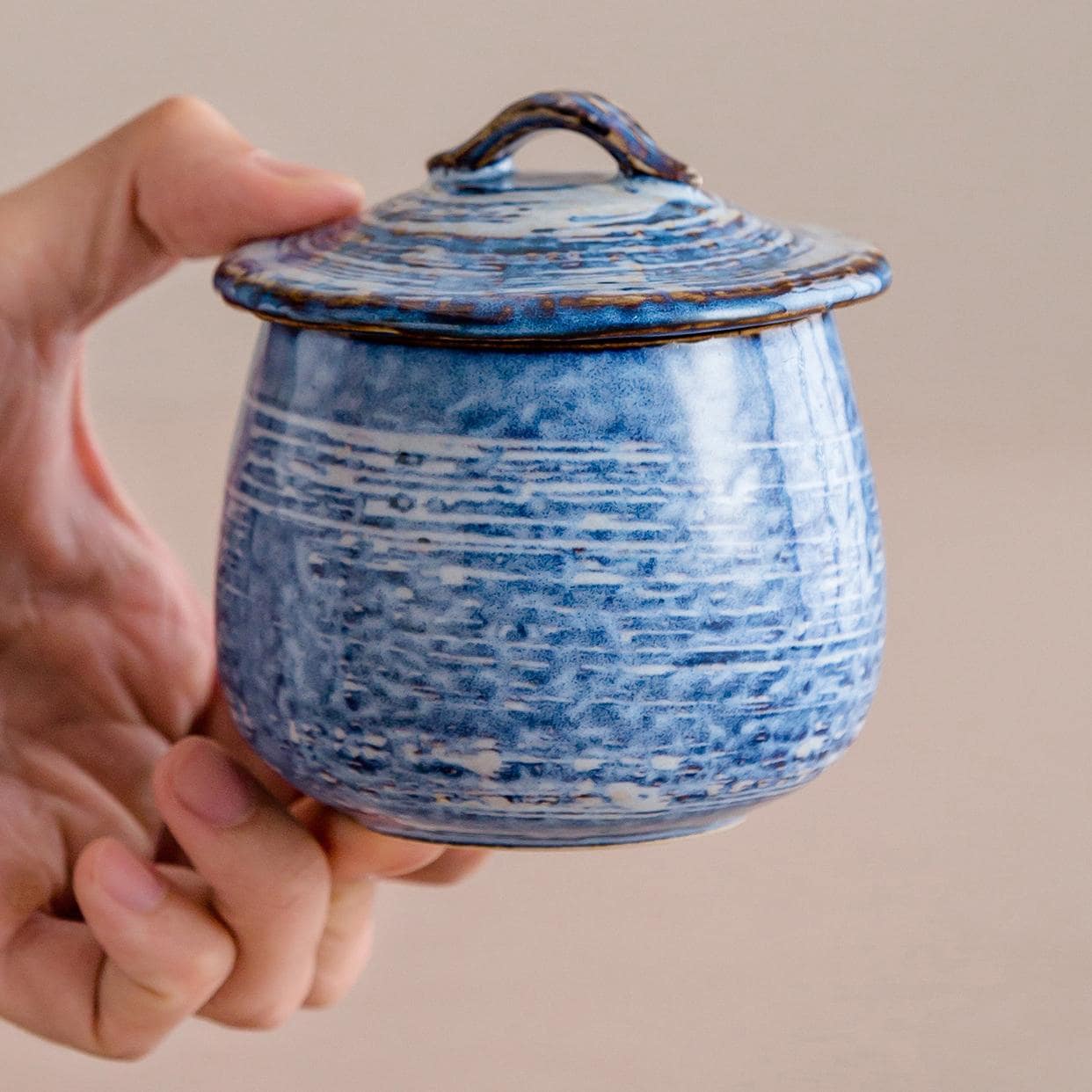 Artisan ceramic stew pots with polka dot patterns