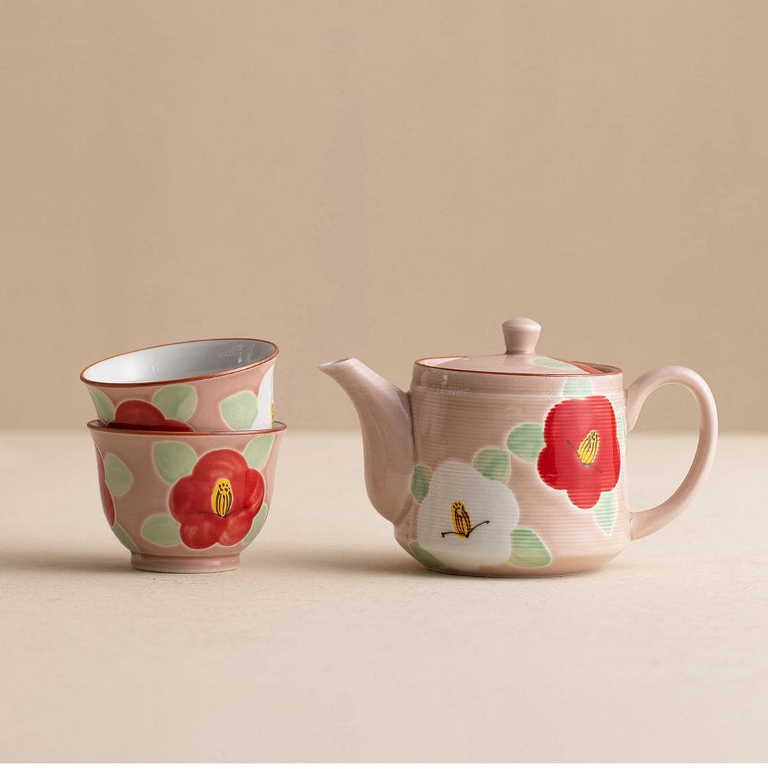 Hand-painted ceramic tea set with camellia flowers and wooden box.