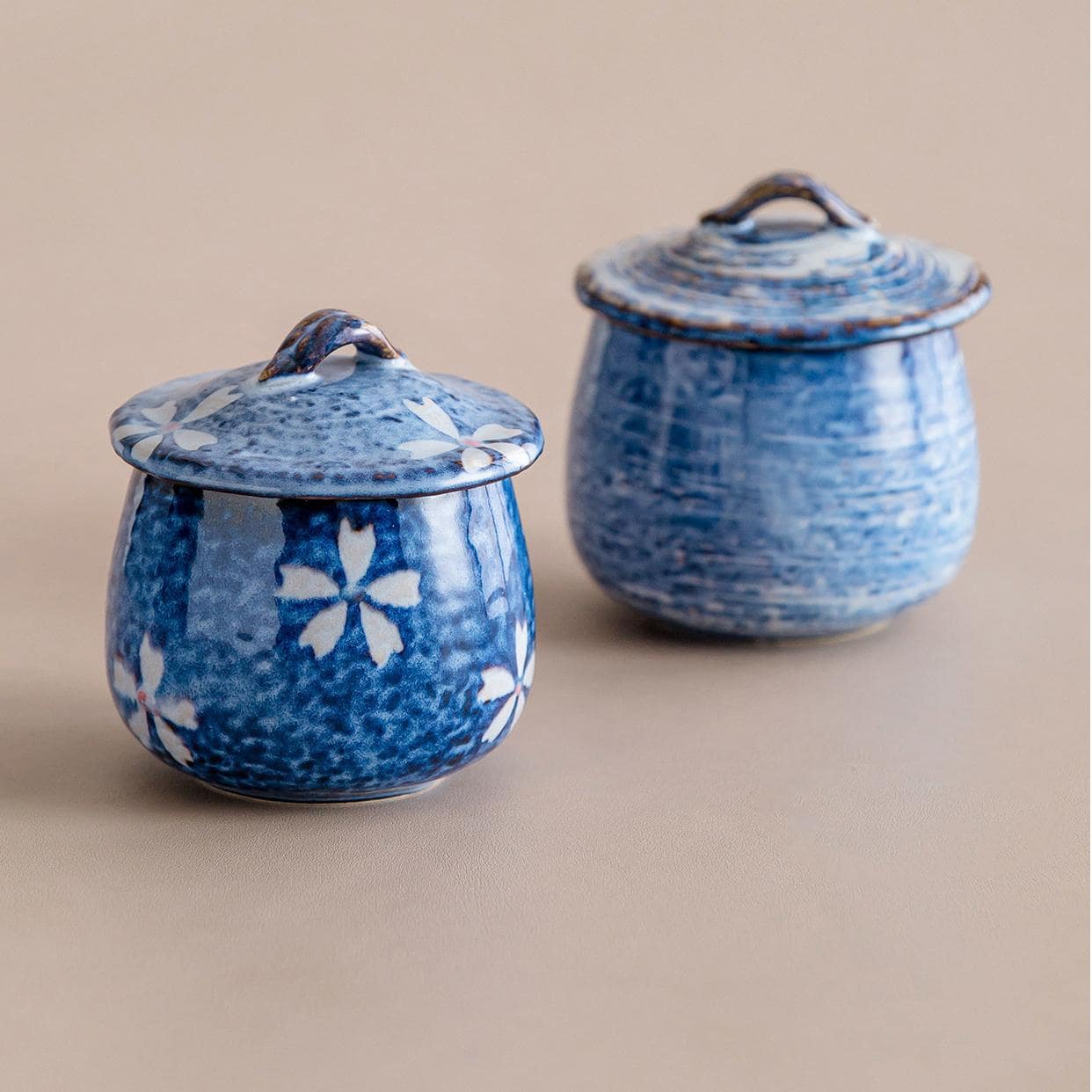 Handcrafted ceramic stew pots with artistic lids