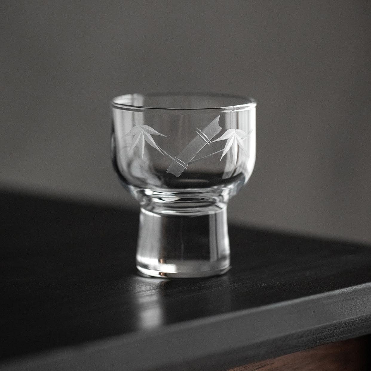 Close-up of floral etched pattern on crystal wine glass