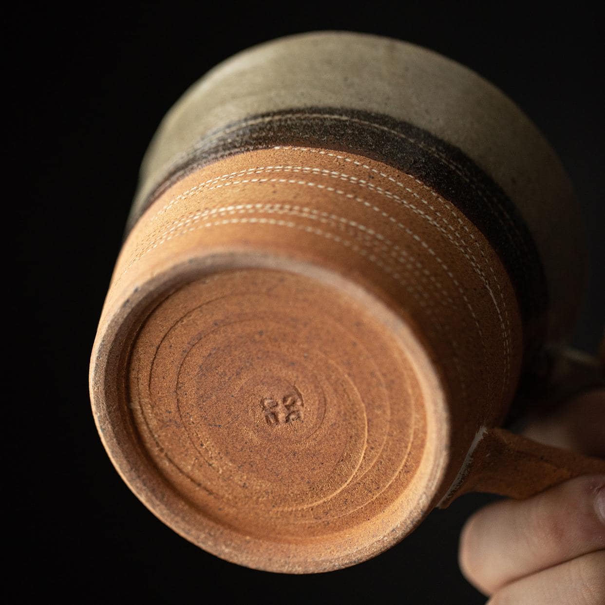 Artistic ceramic cup and saucer set for elegant dining.